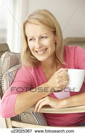 Stock Photo - Senior woman at home. Fotosearch