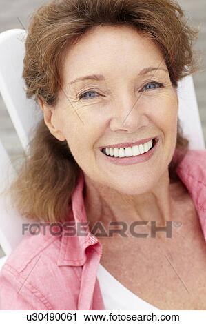 Stock Image - Senior woman head and shoulders. Fotosearch
