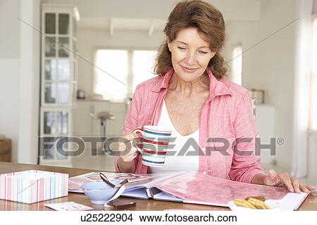 Picture - Senior woman scrapbooking. Fotosearch