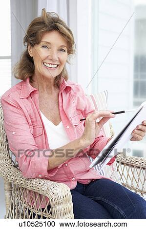 Senior woman sketching View Large Photo Image Stock Image - Senior woman sketching. Fotosearch