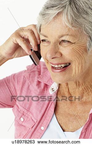 Senior woman talking on phone View Large Photo Image Stock Image - Senior woman talking on phone. Fotosearch