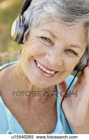 Senior woman with headphone View Large Photo Image Stock Photography - Senior woman with headphone. Fotosearch