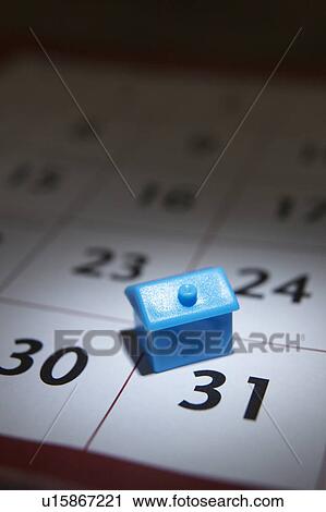 Small model house and calender View Large Photo Image Stock Image - Small model house and calender. Fotosearch