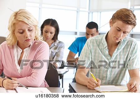 Stock Photo - Students working in classroom. Fotosearch