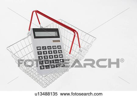 Stock Photography - supermarket basket and calculator. Fotosearch