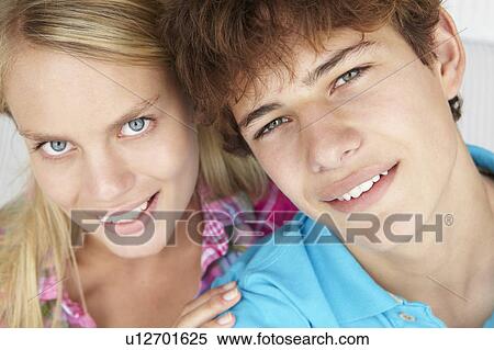 Stock Photography - Teenage boy and girl head and shoulders. Fotosearch