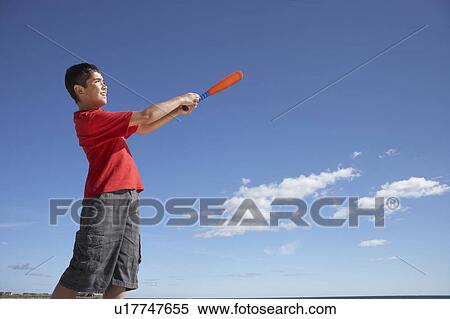 Teenage boy playing baseball View Large Photo Image Stock Photography - Teenage boy playing baseball. Fotosearch