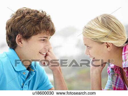 Teenage girl and boy head and shoulders in profile View Large Photo Image Stock Image - Teenage girl and boy head and shoulders in profile. Fotosearch