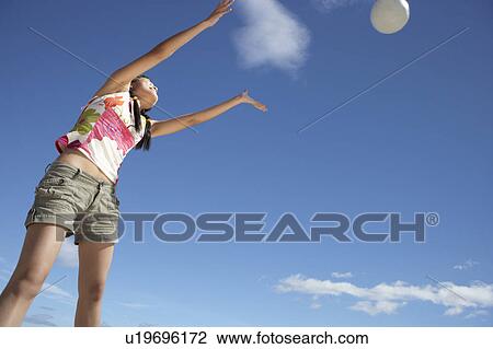 Teenage girl throwing ball View Large Photo Image Stock Image - Teenage girl throwing ball. Fotosearch