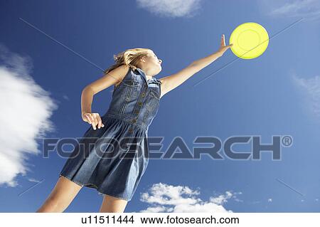 Picture - Teenage girl with frisbee. Fotosearch