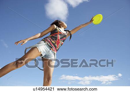 Teenage girl with frisbee View Large Photo Image Stock Image - Teenage girl with frisbee. Fotosearch