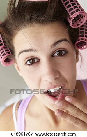 Teenage girl with hair in curlers View Large Photo Image Stock Photo - Teenage girl with hair in curlers. Fotosearch