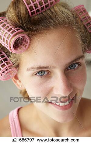 Teenage girl with hair in curlers View Large Photo Image Stock Photo - Teenage girl with hair in curlers. Fotosearch