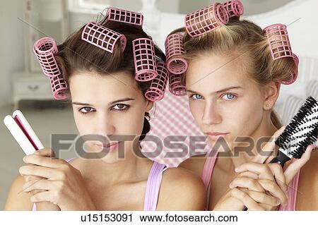 Teenage girls with hair in curlers View Large Photo Image Stock Image - Teenage girls with hair in curlers. Fotosearch