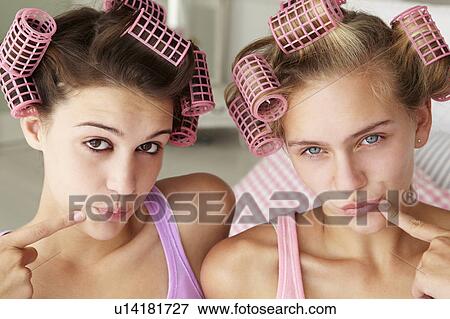 Stock Photo - Teenage girls with hair in curlers. Fotosearch