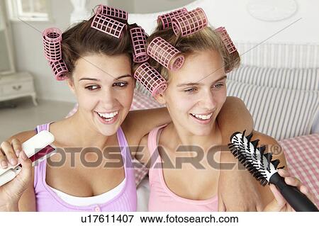 Teenage girls with hair in curlers View Large Photo Image Stock Photo - Teenage girls with hair in curlers. Fotosearch