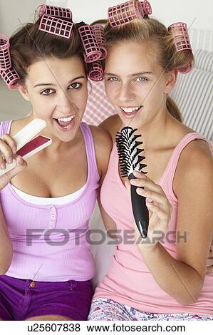 Teenage girls with hair in curlers View Large Photo Image Stock Photo - Teenage girls with hair in curlers. Fotosearch