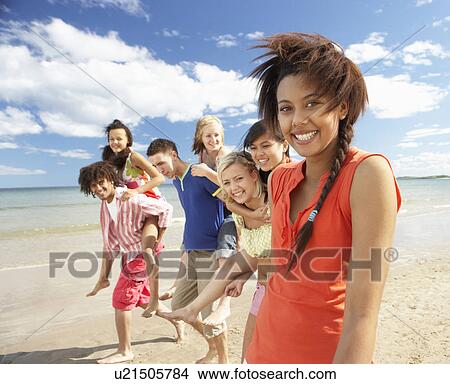 Teenagers walking on beach View Large Photo Image Picture - Teenagers walking on beach. Fotosearch