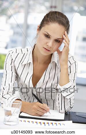 Thoughtful young businesswoman View Large Photo Image Stock Image - Thoughtful young businesswoman. Fotosearch