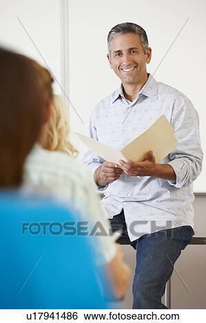 Tutor with class of students View Large Photo Image Stock Photograph - Tutor with class of students. Fotosearch