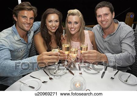 Two young couples in restaurant View Large Photo Image Stock Image - Two young couples in restaurant. Fotosearch