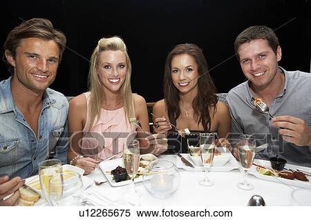 Two young couples in restaurant View Large Photo Image Stock Photography - Two young couples in restaurant. Fotosearch