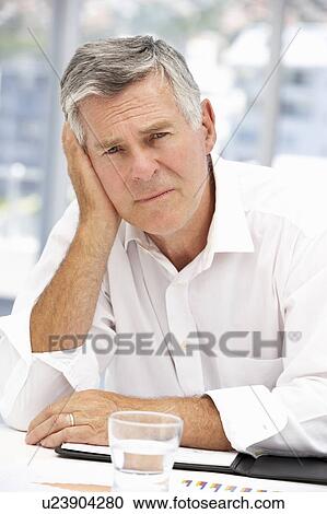 Unhappy senior businessman View Large Photo Image Stock Image - Unhappy senior businessman. Fotosearch
