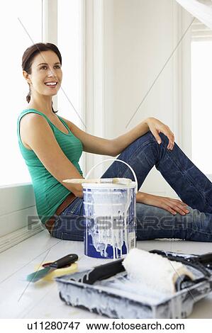 Stock Photo - Woman decorating house. Fotosearch