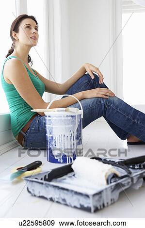 Stock Photo - Woman decorating house. Fotosearch