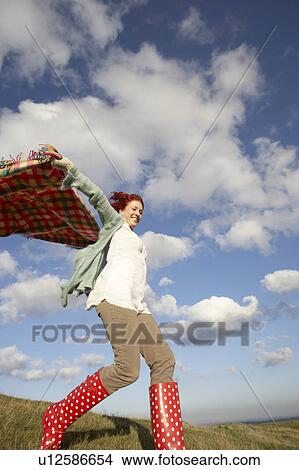 Picture - Woman in countryside. Fotosearch