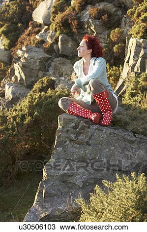 Stock Image - Woman in countryside. Fotosearch
