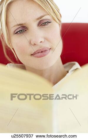 Stock Photo - Woman reading book. Fotosearch