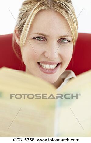 Woman reading book View Large Photo Image Stock Photograph - Woman reading book. Fotosearch
