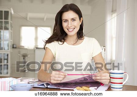 Stock Photo - Woman scrapbooking. Fotosearch