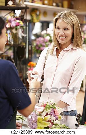 Woman shopping in florist View Large Photo Image Stock Photo - Woman shopping in florist. Fotosearch