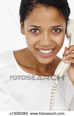 Woman talking on telephone View Large Photo Image Stock Image - Woman talking on telephone. Fotosearch