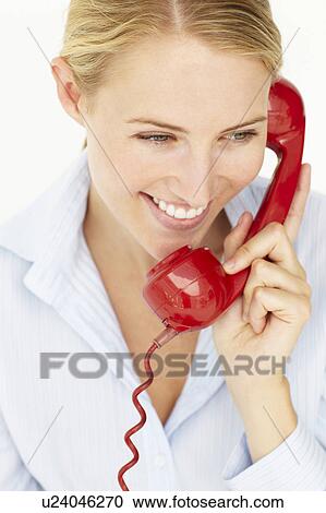 Woman talking on telephone View Large Photo Image Stock Image - Woman talking on telephone. Fotosearch