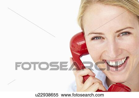 Woman talking on telephone View Large Photo Image Stock Photography - Woman talking on telephone. Fotosearch