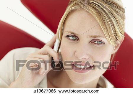 Stock Photograph - Woman talking on the phone. Fotosearch