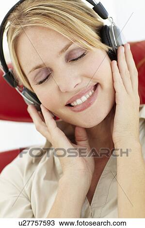 Stock Image - Woman with headphones. Fotosearch