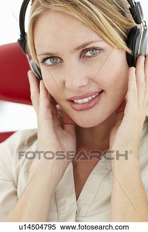 Woman with headphones View Large Photo Image Stock Photography - Woman with headphones. Fotosearch