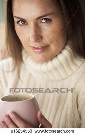 Woman with hot drink View Large Photo Image Stock Image - Woman with hot drink. Fotosearch