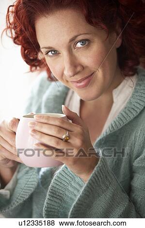 Woman with hot drink View Large Photo Image Stock Photo - Woman with hot drink. Fotosearch
