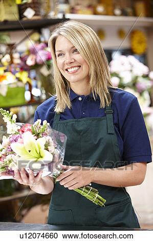 Woman working in florist View Large Photo Image Stock Image - Woman working in florist. Fotosearch