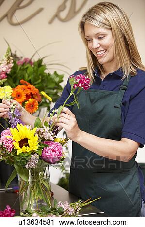 Stock Image - Woman working in florist. Fotosearch