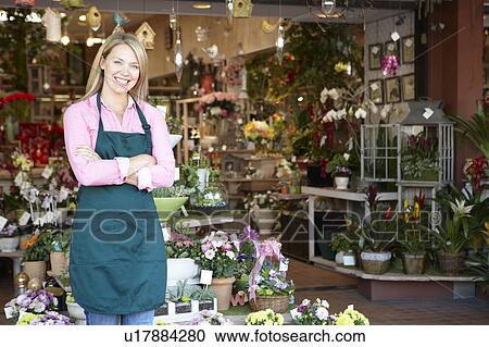 Woman working in florist View Large Photo Image Stock Image - Woman working in florist. Fotosearch