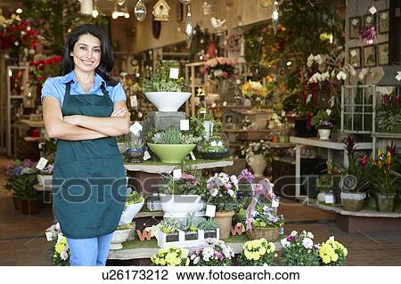 Stock Image - Woman working in florist. Fotosearch