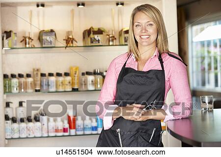 Woman working in hairdressing salon View Large Photo Image Picture - Woman working in hairdressing salon. Fotosearch