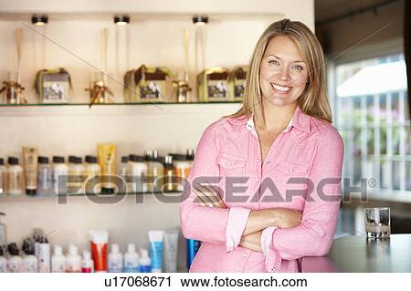 Woman working in hairdressing salon View Large Photo Image Stock Image - Woman working in hairdressing salon. Fotosearch