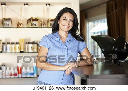 Woman working in hairdressing salon View Large Photo Image Stock Photograph - Woman working in hairdressing salon. Fotosearch